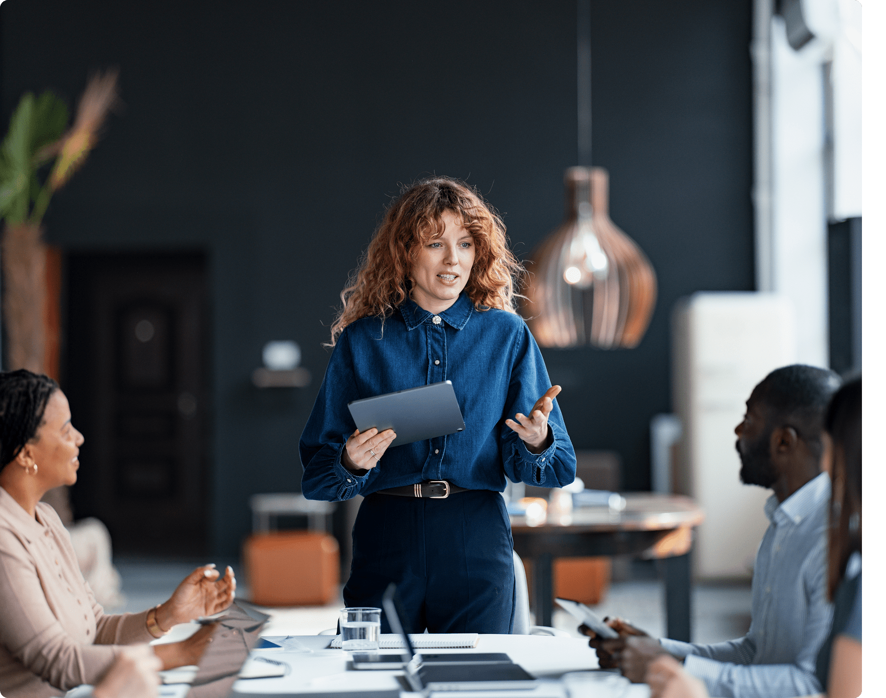 Woman leading a meeting with colleagues
